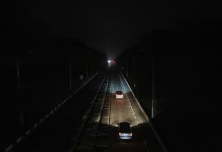 Traffic moves across the city center without power in Kharkiv, Ukraine